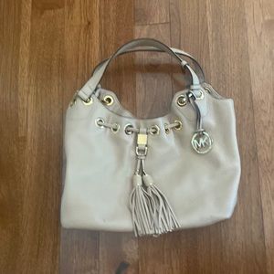 Michael Kors tan leather bag. Length 12”-height-9.5”-width-4.5.